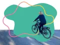Une personne fait du vélo, promouvant les mobilités actives.