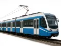 Un tram moderne bleu et blanc, un bus bhns, circule sur des rails.