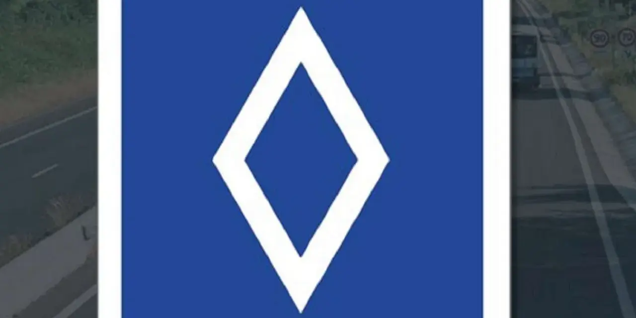 Panneau bleu avec un losange blanc. Ce panneau indique une voie réservée aux bus.