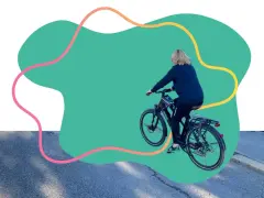 Une personne fait du vélo, promouvant les mobilités actives.