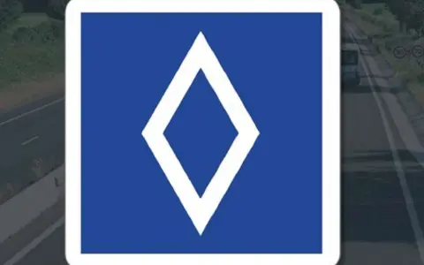 Panneau bleu avec un losange blanc. Ce panneau indique une voie réservée aux bus.