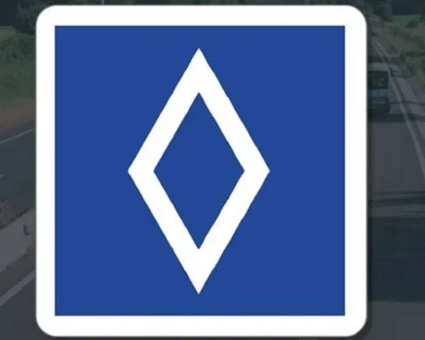 Panneau bleu avec un losange blanc. Ce panneau indique une voie réservée aux bus.
