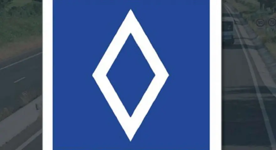 Panneau bleu avec un losange blanc. Ce panneau indique une voie réservée aux bus.
