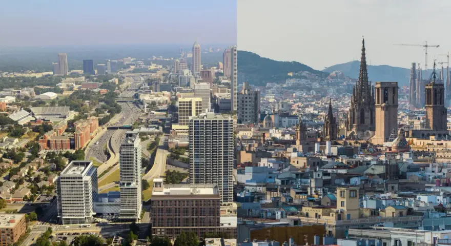 Vue aérienne d'une aire urbaine exemple, montrant des gratte-ciel modernes et des quartiers résidentiels d'un côté, et des bâtiments historiques et des églises de l'autre.